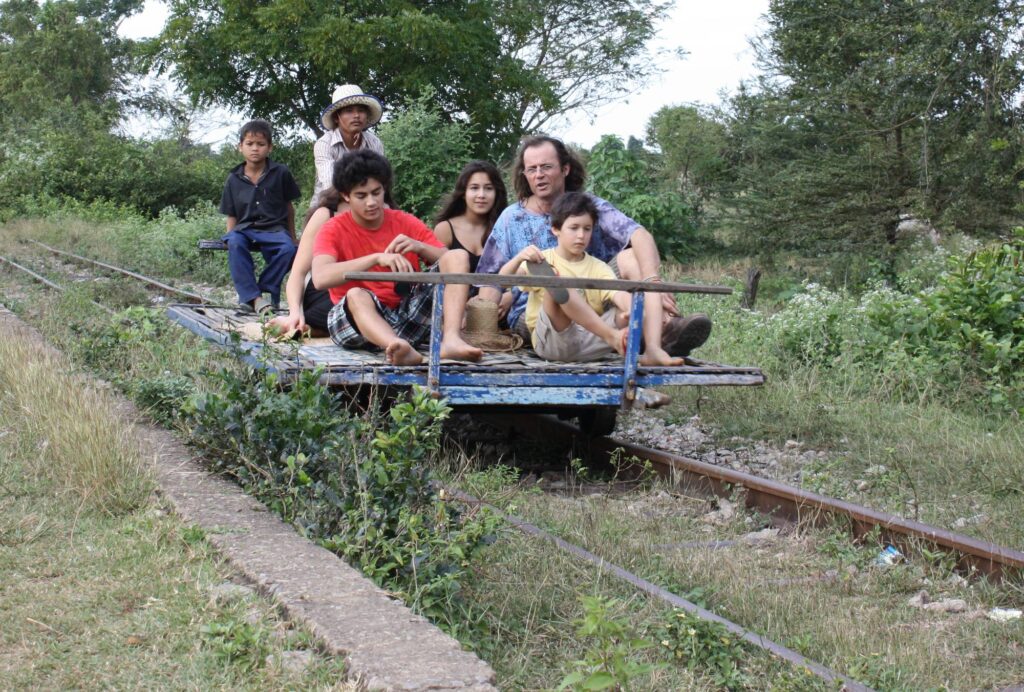 A family riding the bamboo train, Battambang, Cambodia
