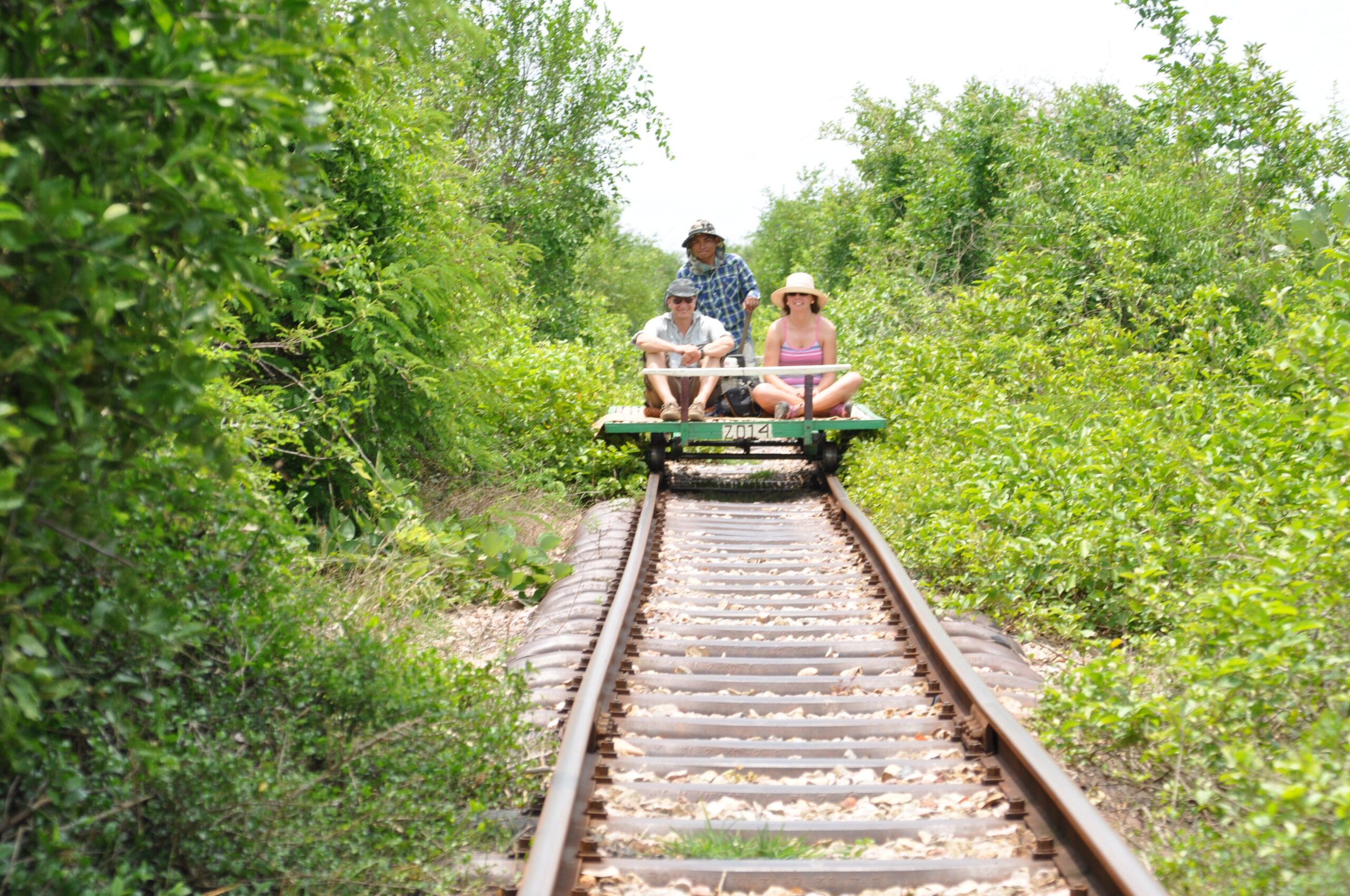 Passengers riding a bamboo train through the countryside, Battambang, Cambodia