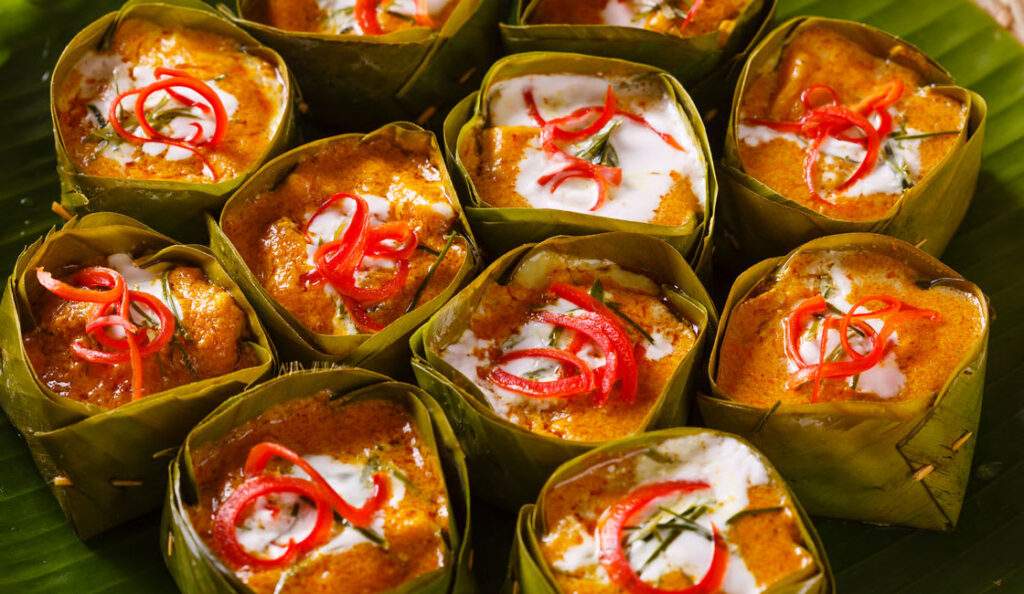 Fish amok, steamed fish curry served in banana-leaf cups