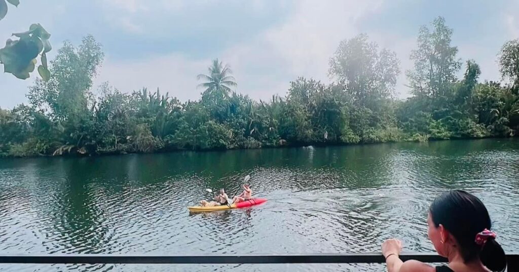 Kayaking on the river at Sea River Lodge, Srae Ambel