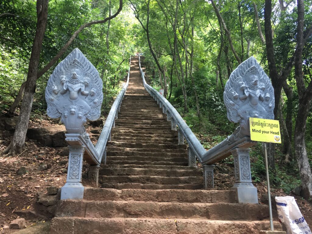 The naga-lined stairway climbing Phnom Banan, Battambang, Cambodia