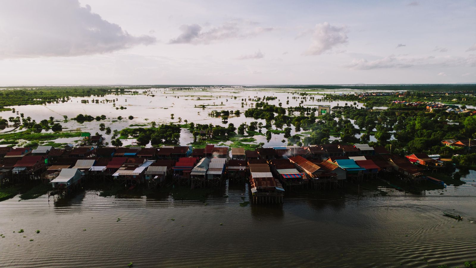 Boats and stilted houses on a lake in Cambodia